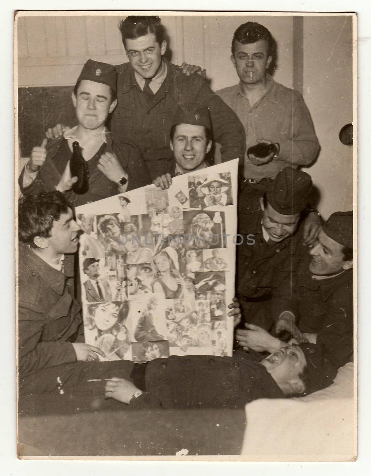 A vintage photo shows soldiers look forward to going out of the Army, circa 1965. by roman_nerud