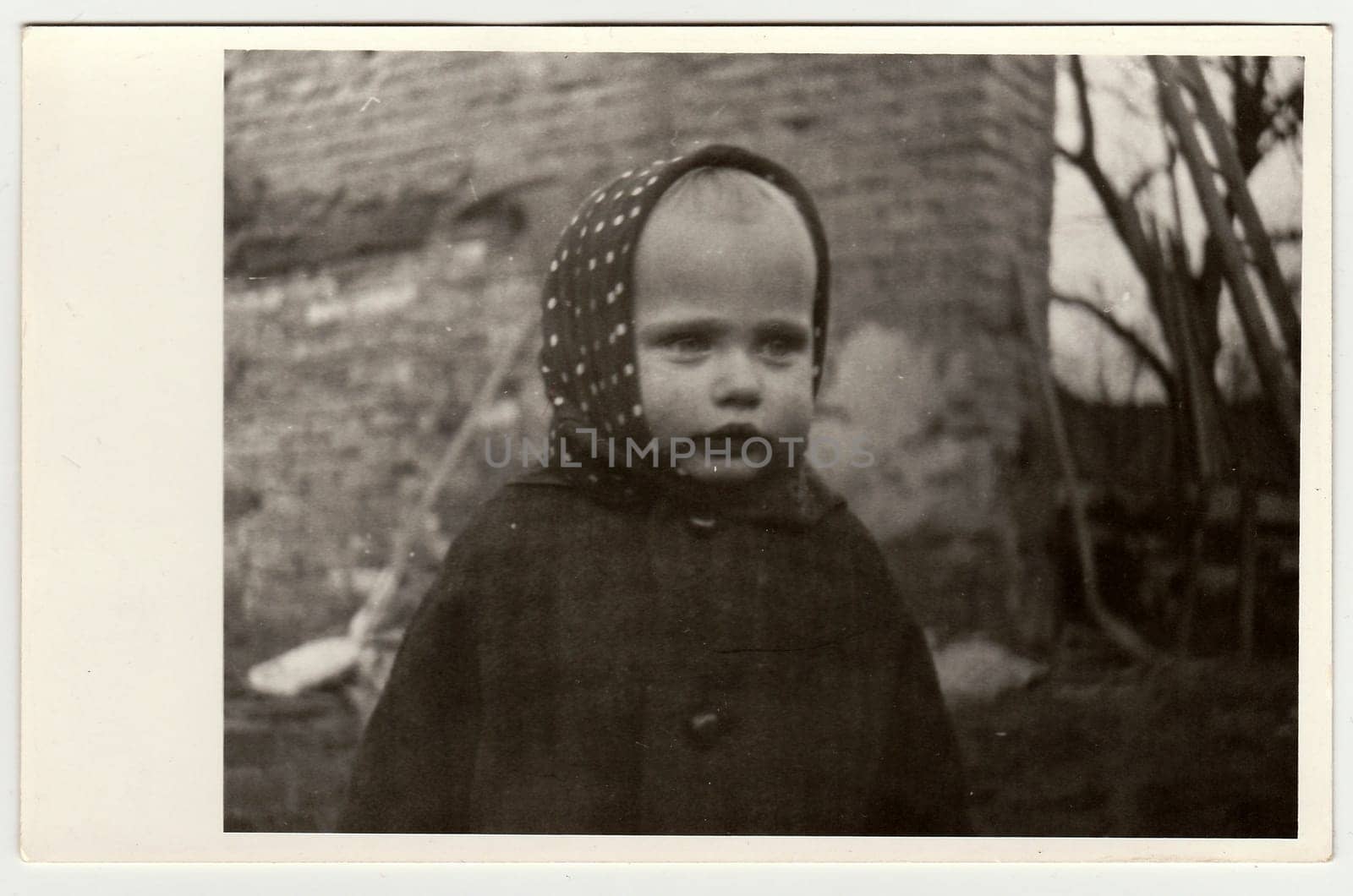 THE CZECHOSLOVAK REPUBLIC, CIRCA 1942: Vintage photo shows a small girl wears bandanna, circa 1942.