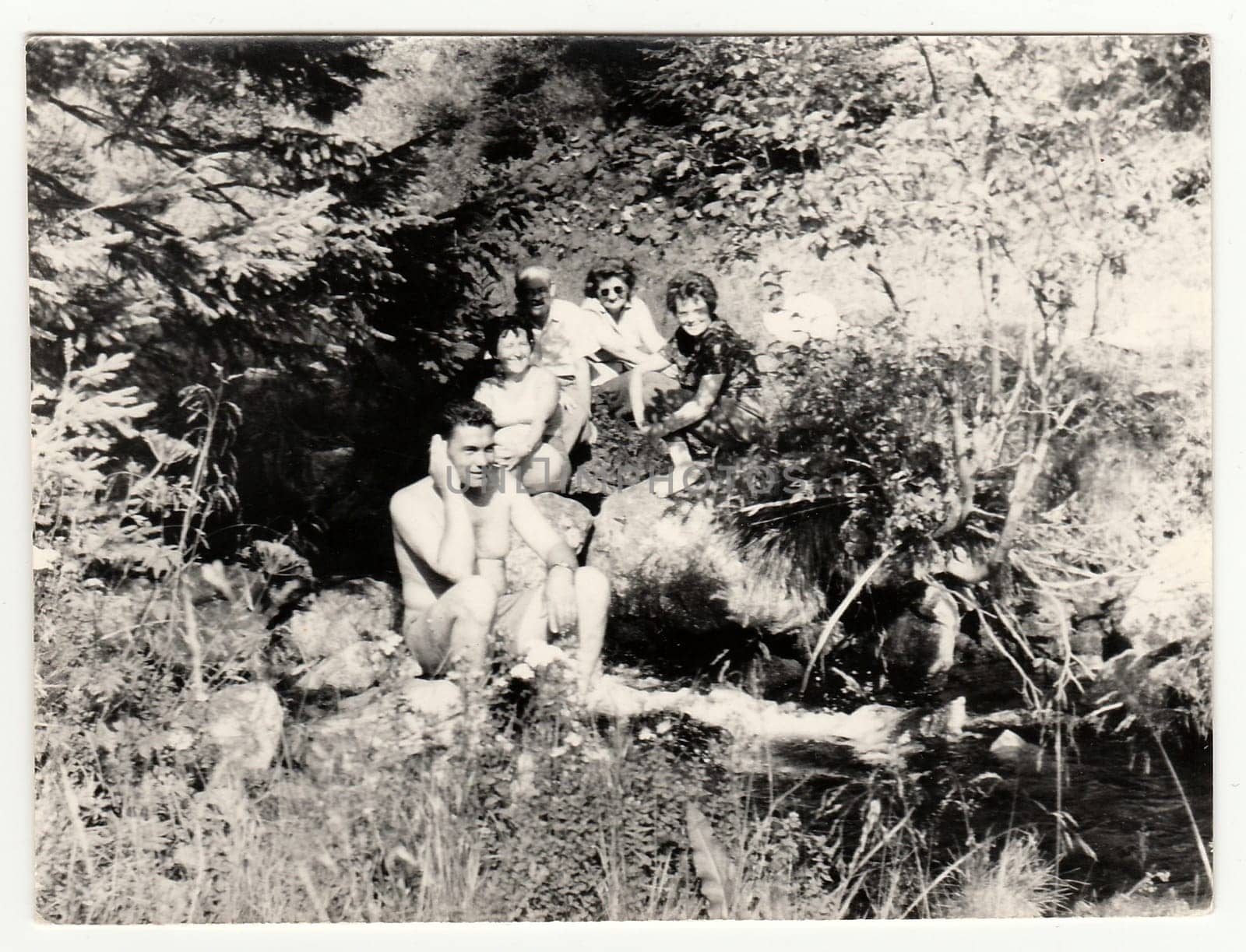 Vintage photo shows people on vacation, circa 1960s. by roman_nerud