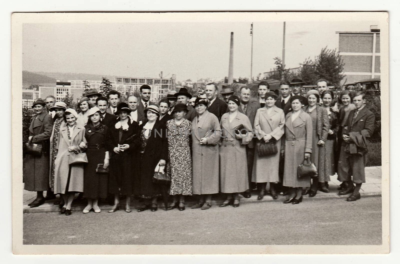 ZLIN, THE CZECHOSLOVAK REPUBLIC - AUGUST 15, 1934: Vintage photo shows group of people in front of Bata factories, on August 15, 1934.