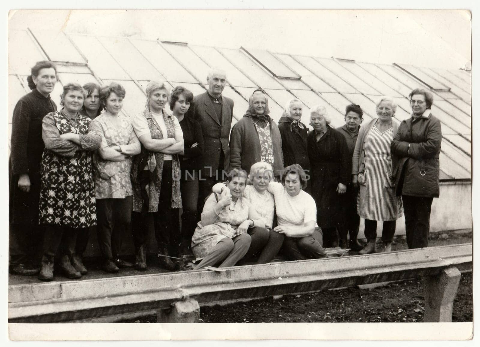 THE CZECHOSLOVAK SOCIALIST REPUBLIC, CIRCA 1980: Vintage photo shows farmers in front of greenhouse.