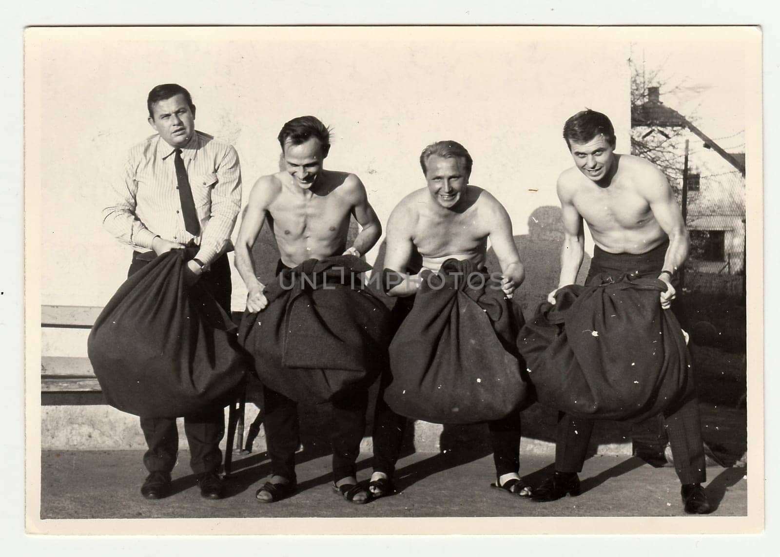 A vintage photo shows soldiers look forward to going out of the Army. by roman_nerud