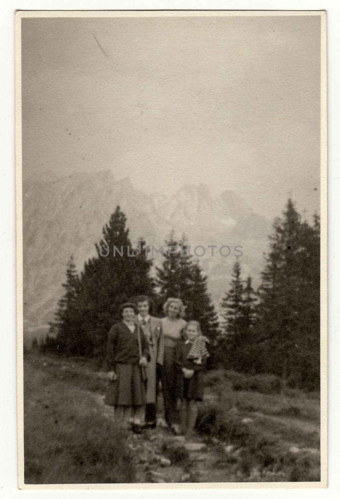 Vintage photo shows people on vacation in mountain. by roman_nerud