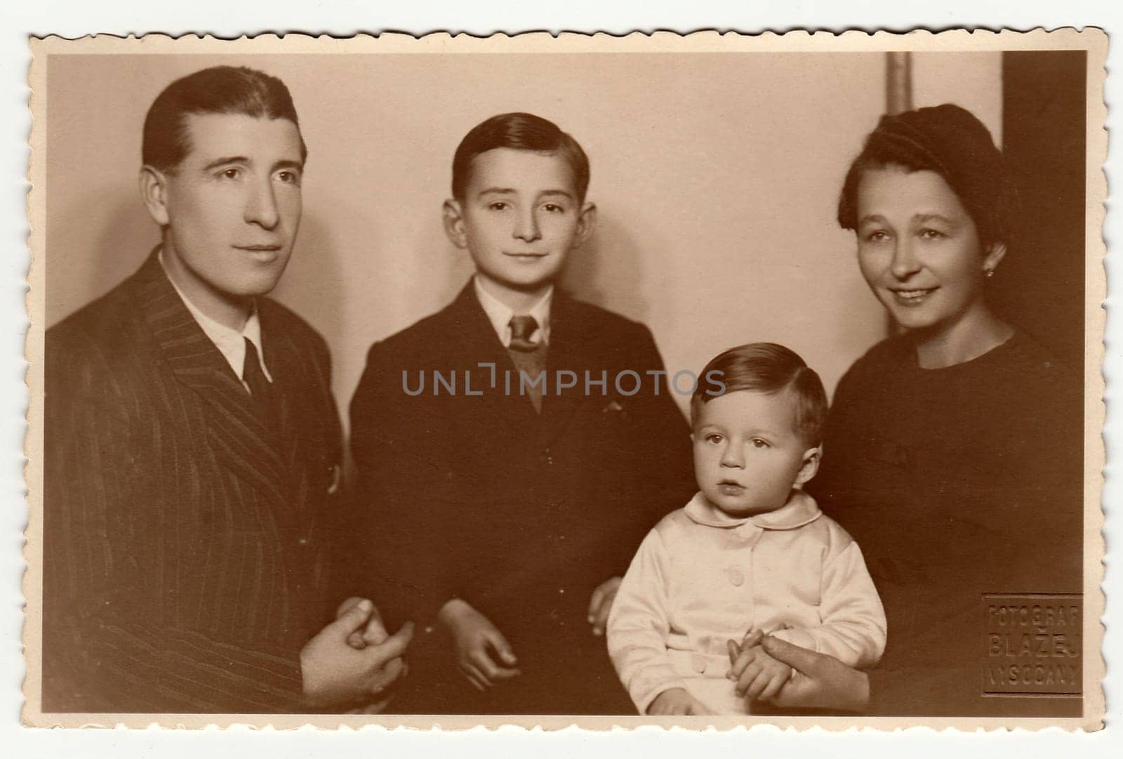 PRAGUE, THE CZECHOSLOVAK SOCIALIST REPUBLIC - CIRCA 1950s: Vintage photo shows family portrait.