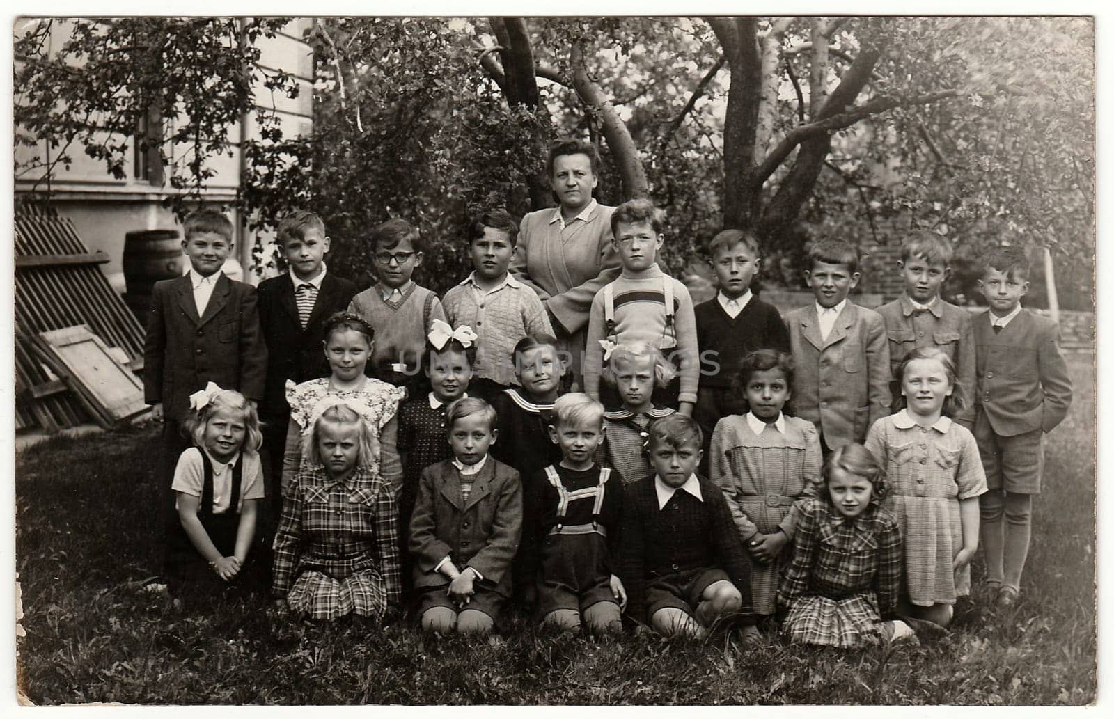 Vintage photo shows classmates (about 10 years old) with teacher by roman_nerud
