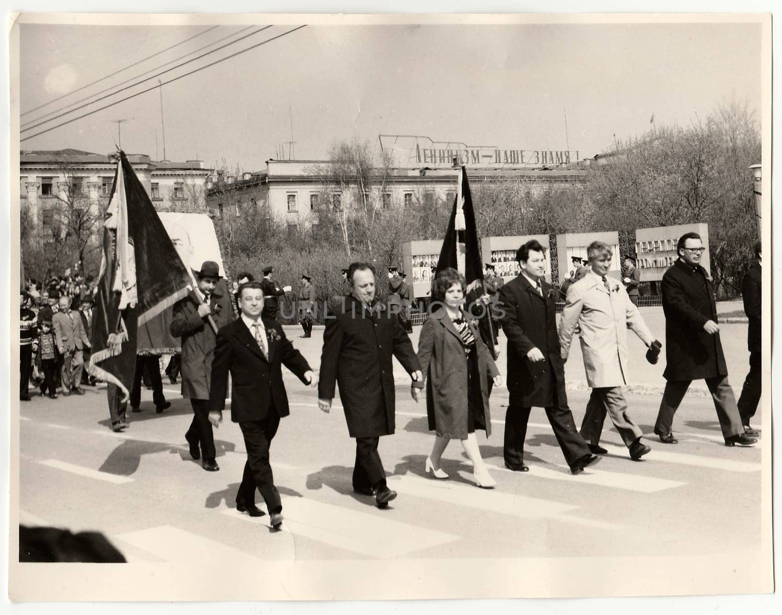 Vintage photo shows people celebratting May Day (International Workers' Day). by roman_nerud