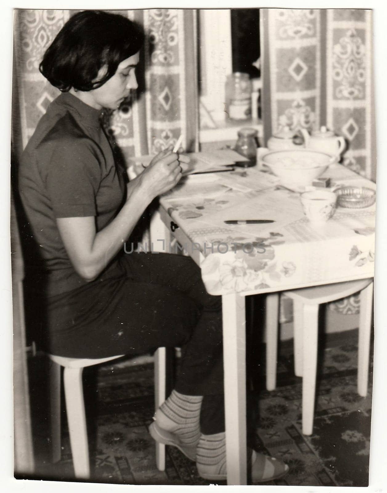 USSR - CIRCA 1970s: Vintage photo shows woman sittting at the table.