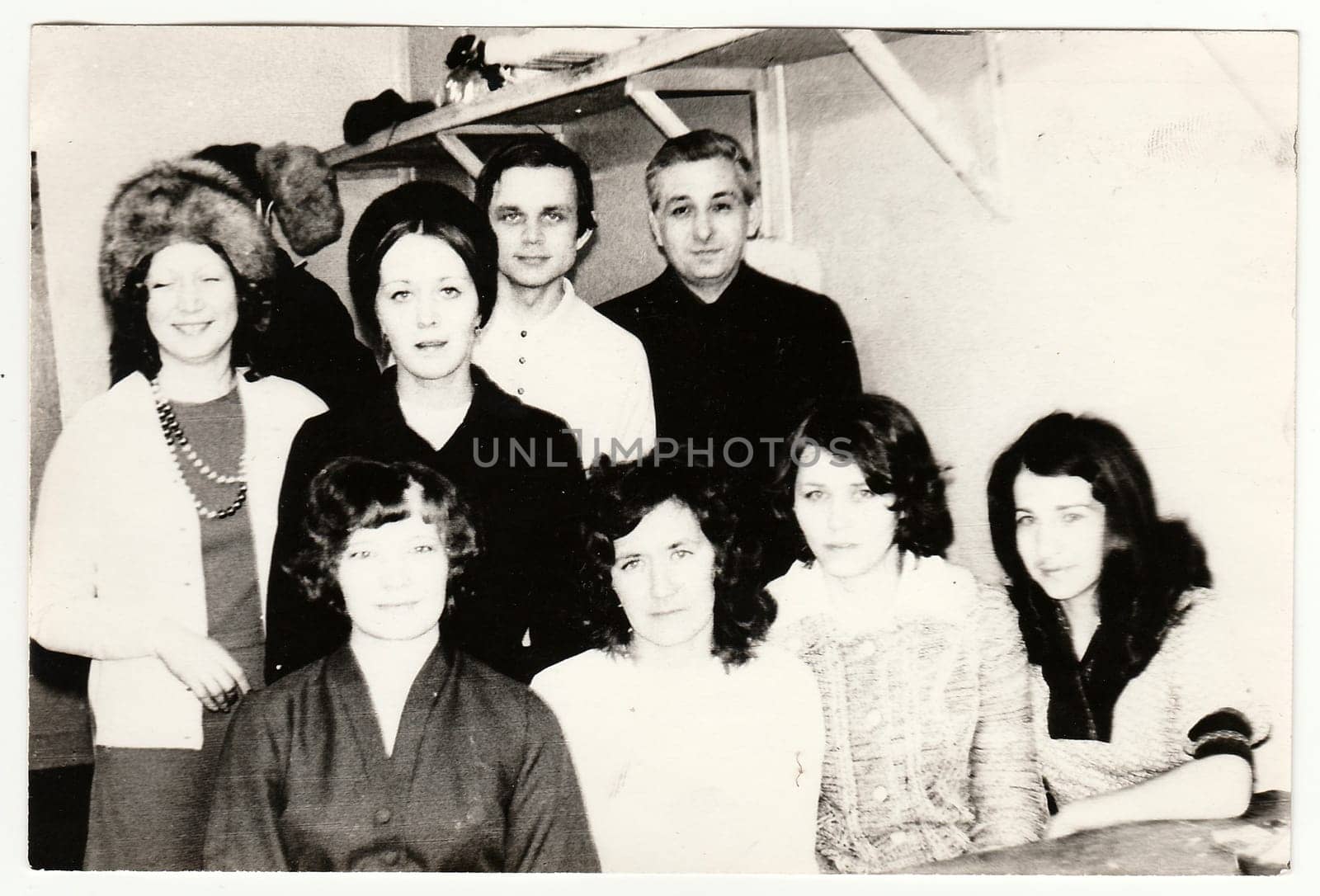 Vintage photo shows women and men at home. by roman_nerud