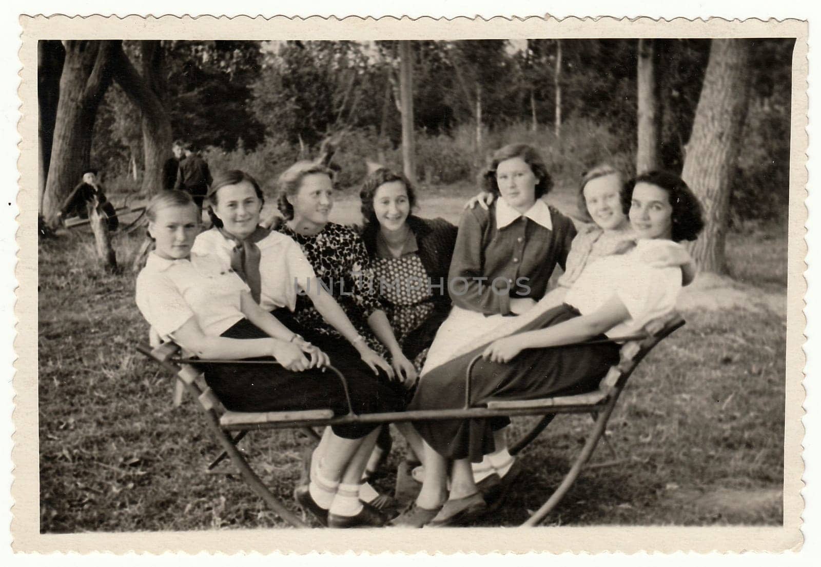 USSR - CIRCA 1950s: Vintage photo shows girls sit on swing