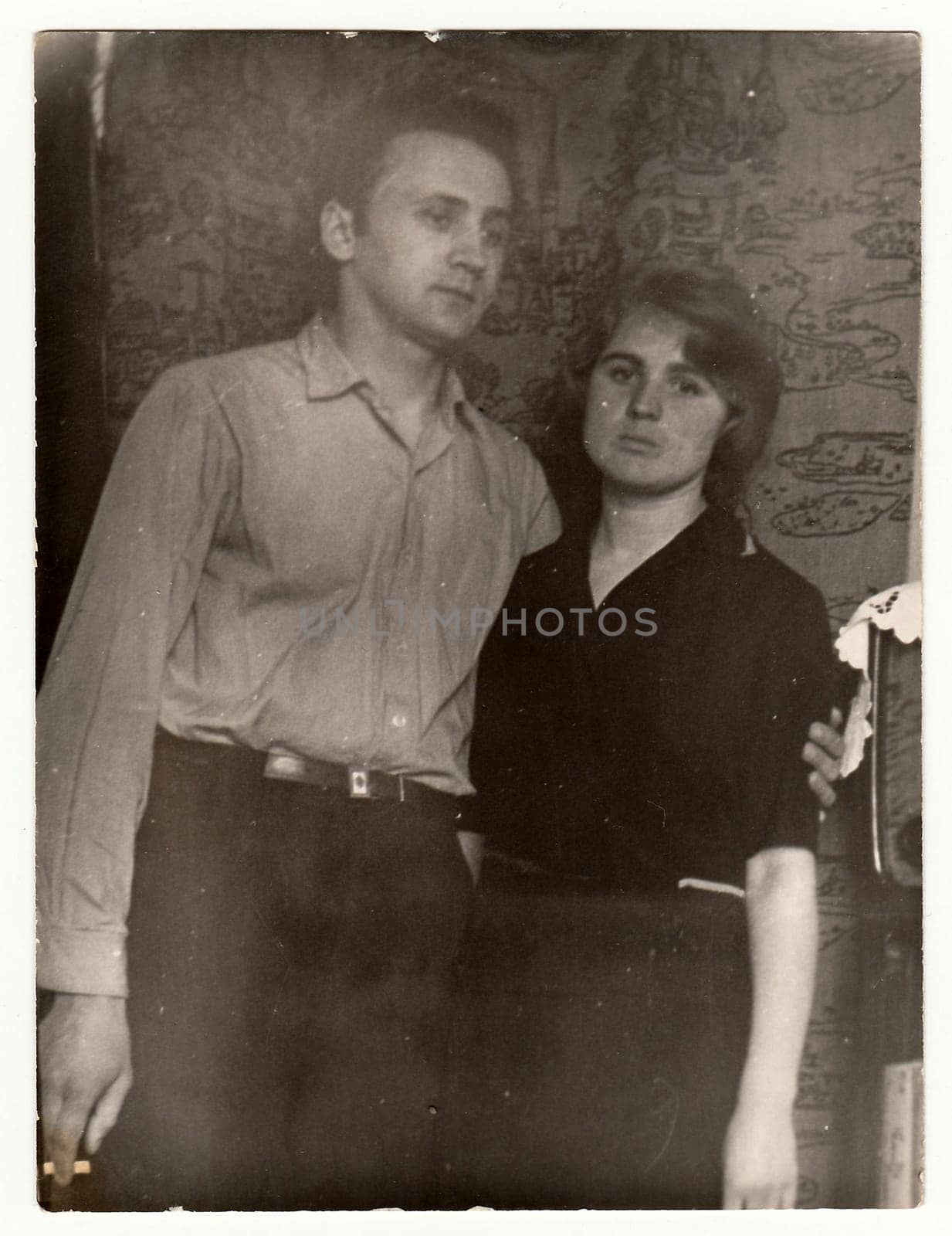 Vintage photo shows a young couple. by roman_nerud