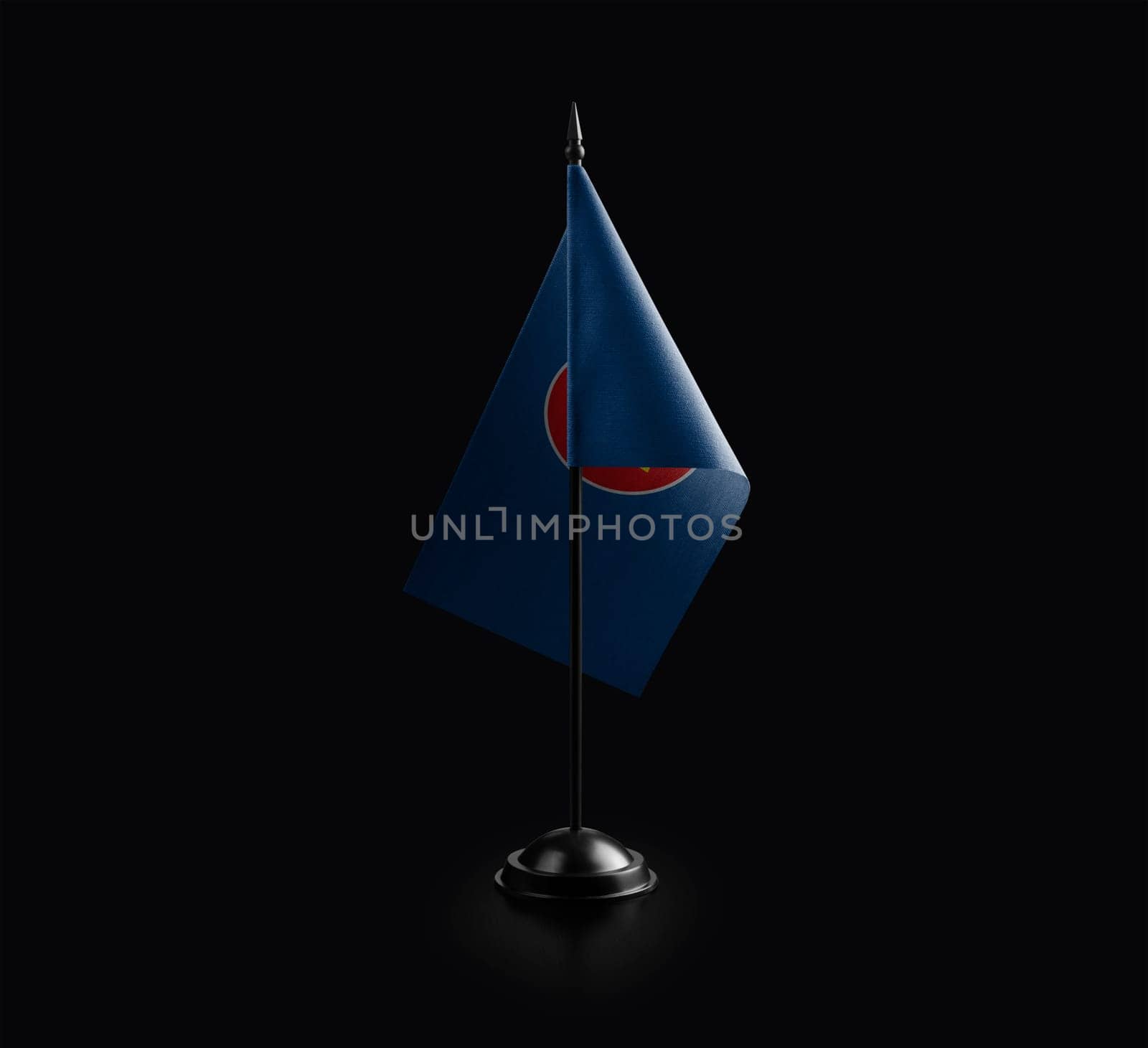Small national flag of the ASEAN on a black background.