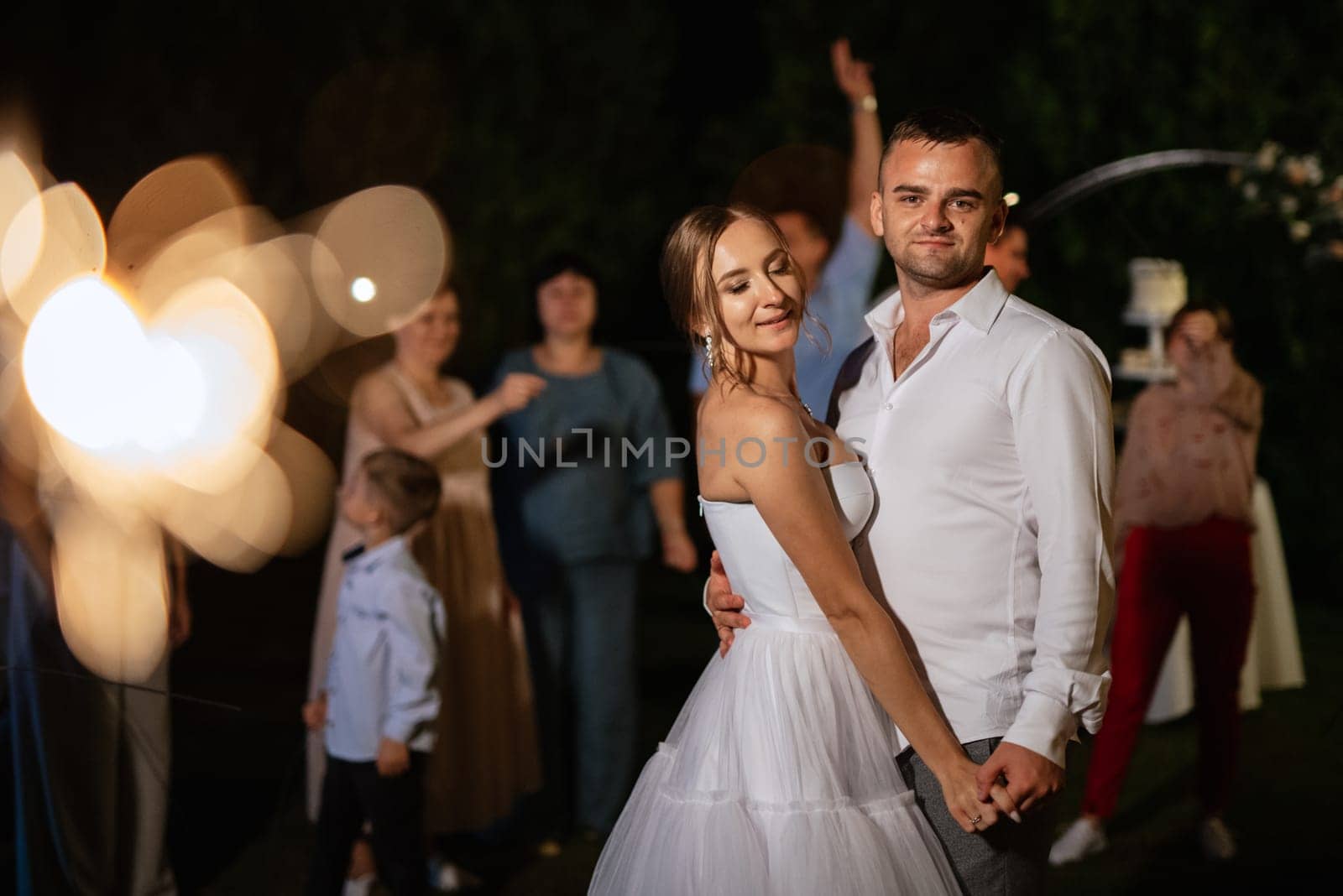newlyweds at a wedding of sparklers by Andreua