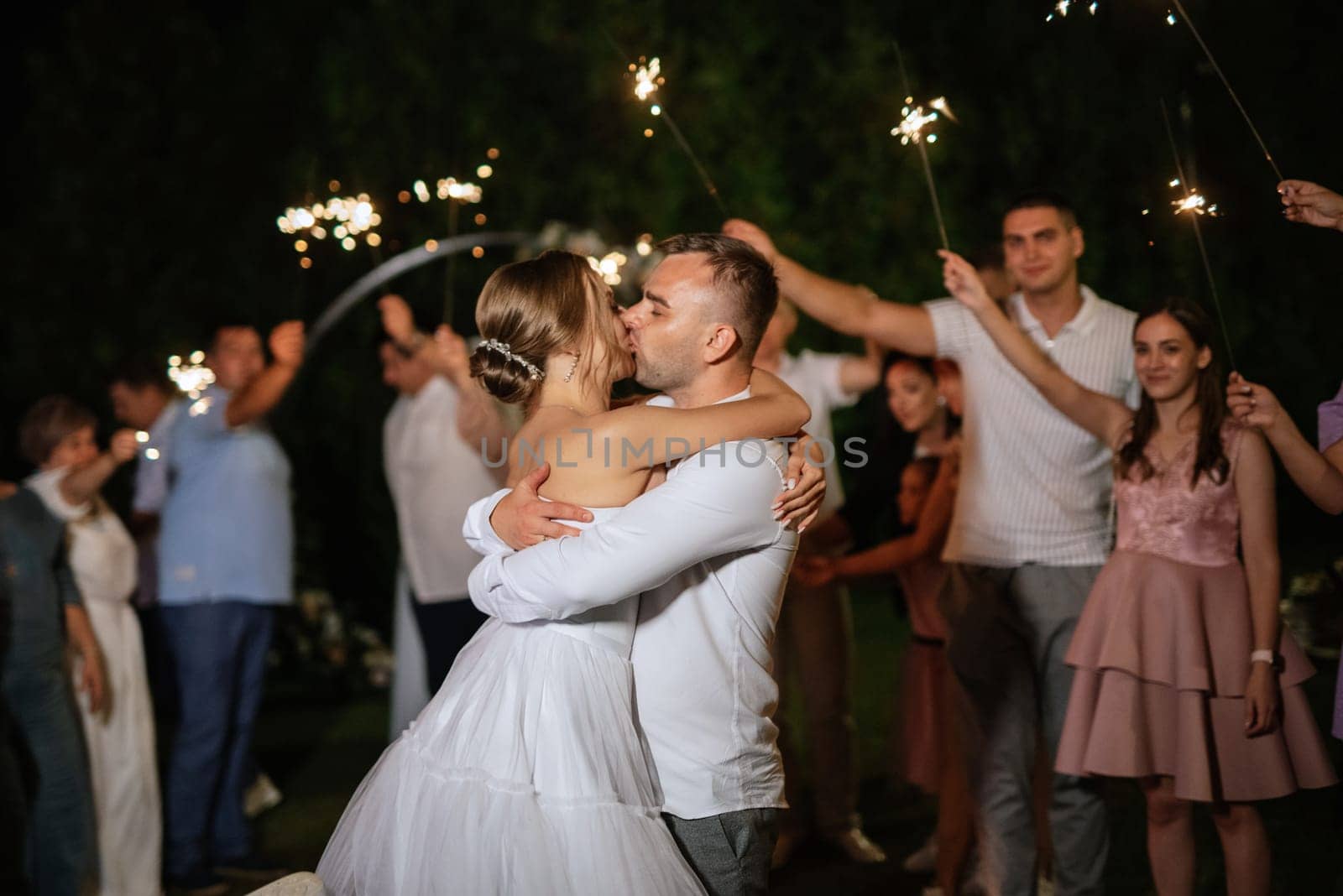 newlyweds at a wedding of sparklers by Andreua