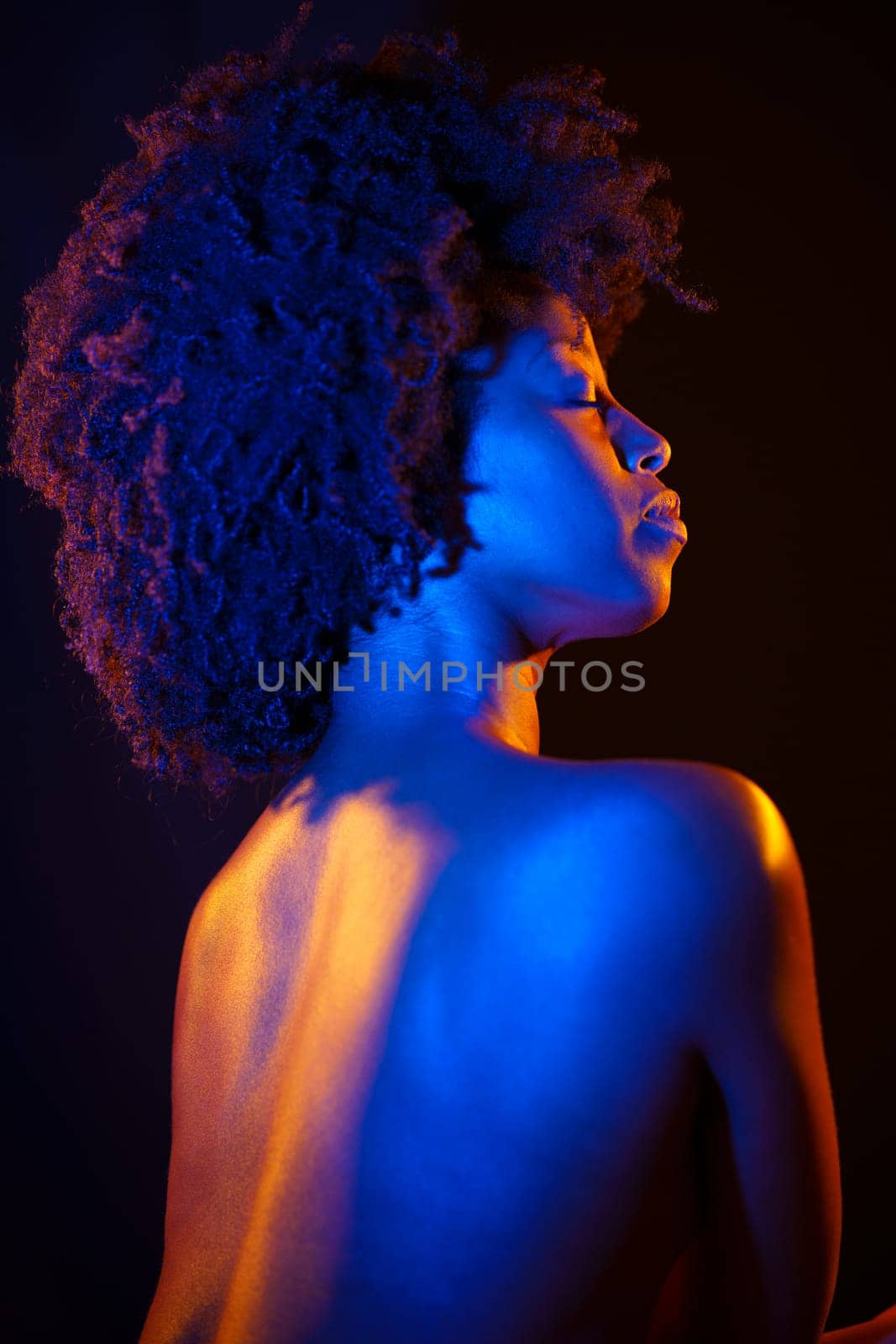 Naked black woman, afro hairstyle, under neon illumination by javiindy