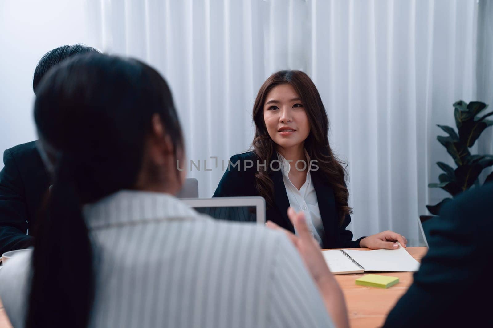 Business team of financial data analysis meeting with business intelligence, report paper and dashboard on laptop for marketing strategy. Business people working together to promote harmony in office.