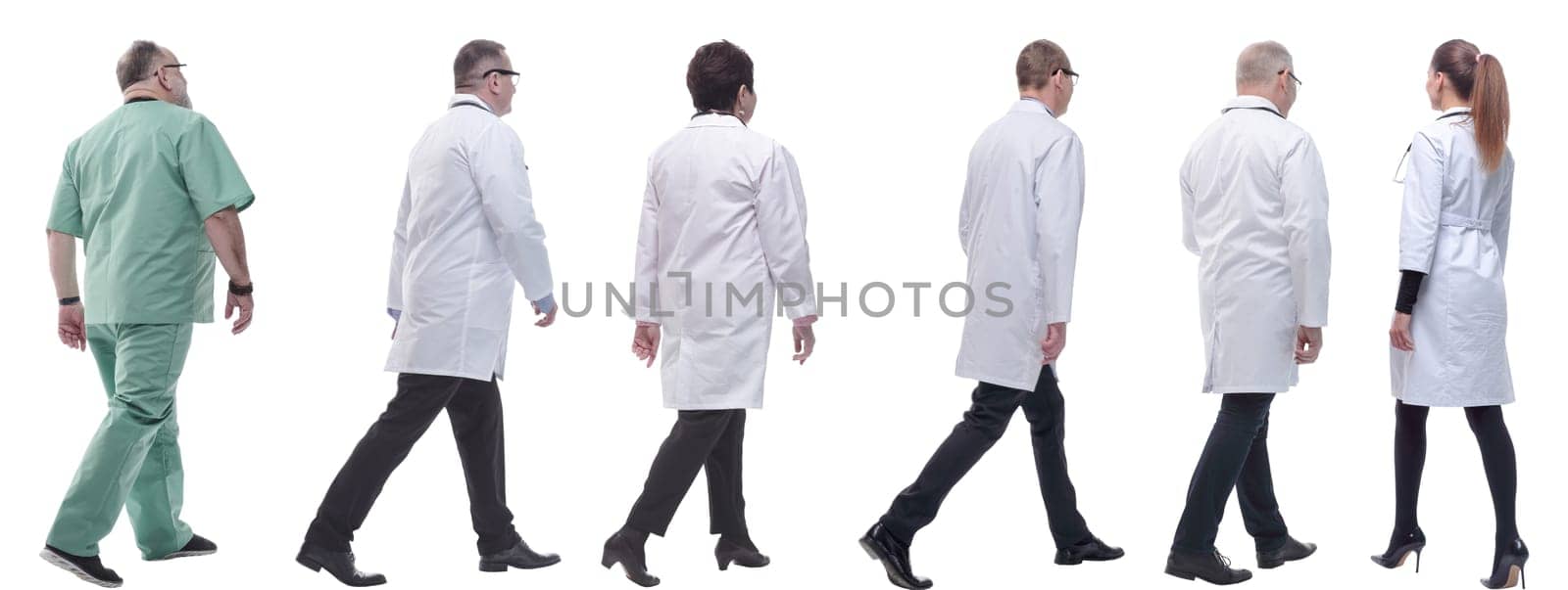 group of doctors in motion isolated on white background