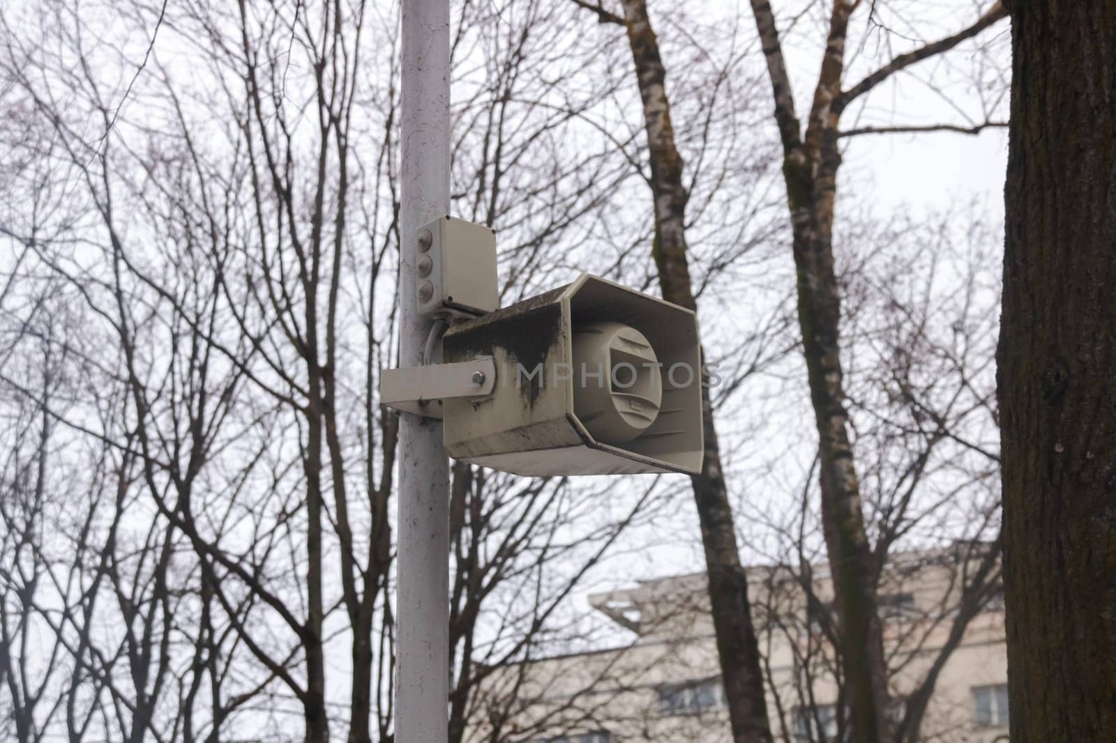 Speaker on a pole in the park close up