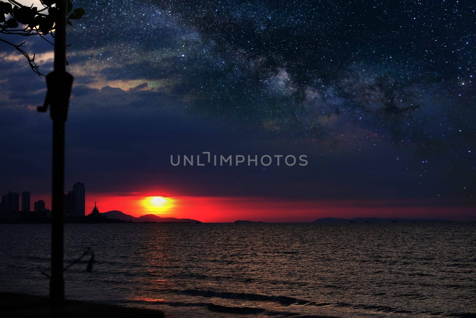 milkyway rise above sea with waves trails for background.