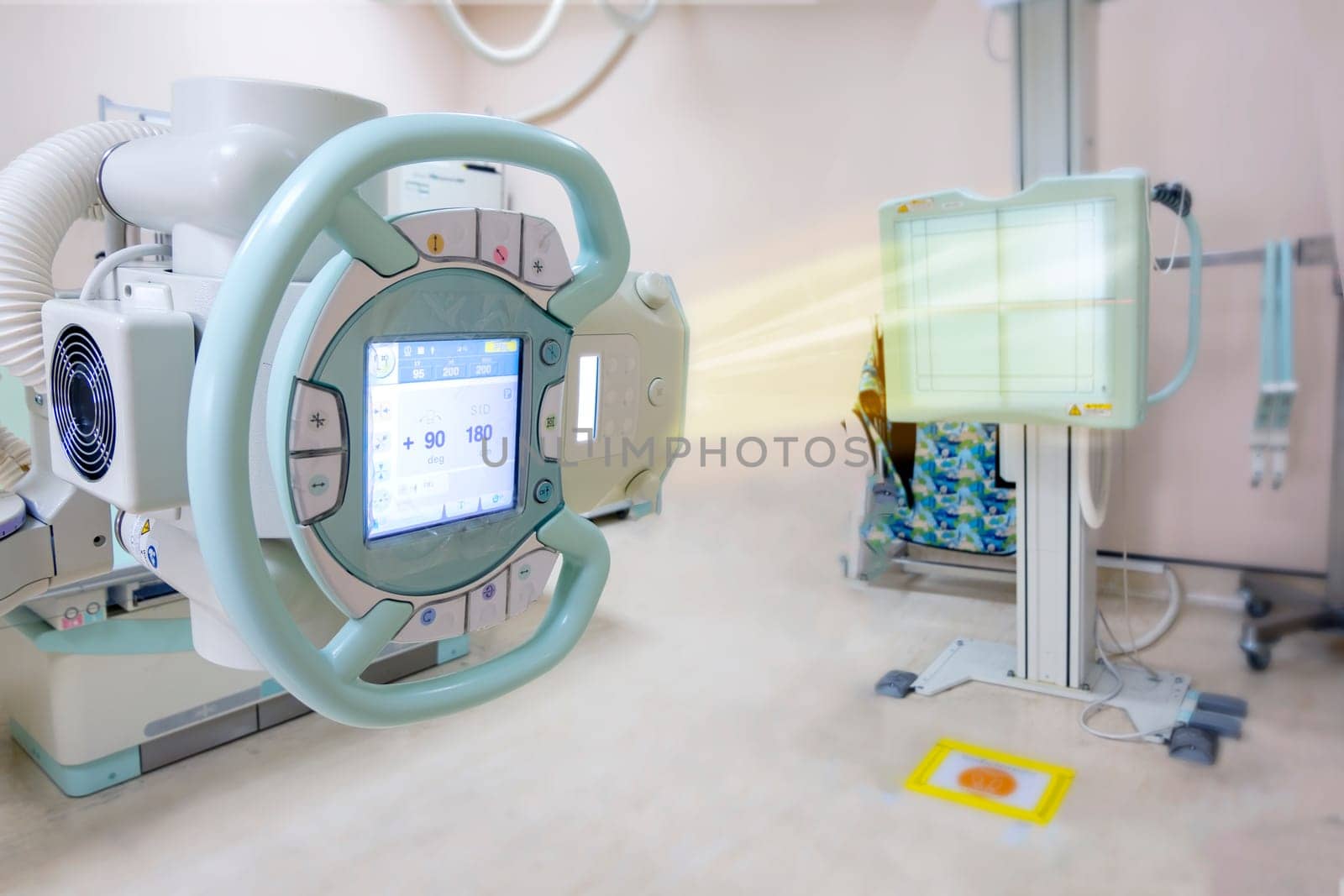 X-ray generator tube with monitor or X-ray general device with Bucky stand in radiology .modern medical equipment in the hospital.