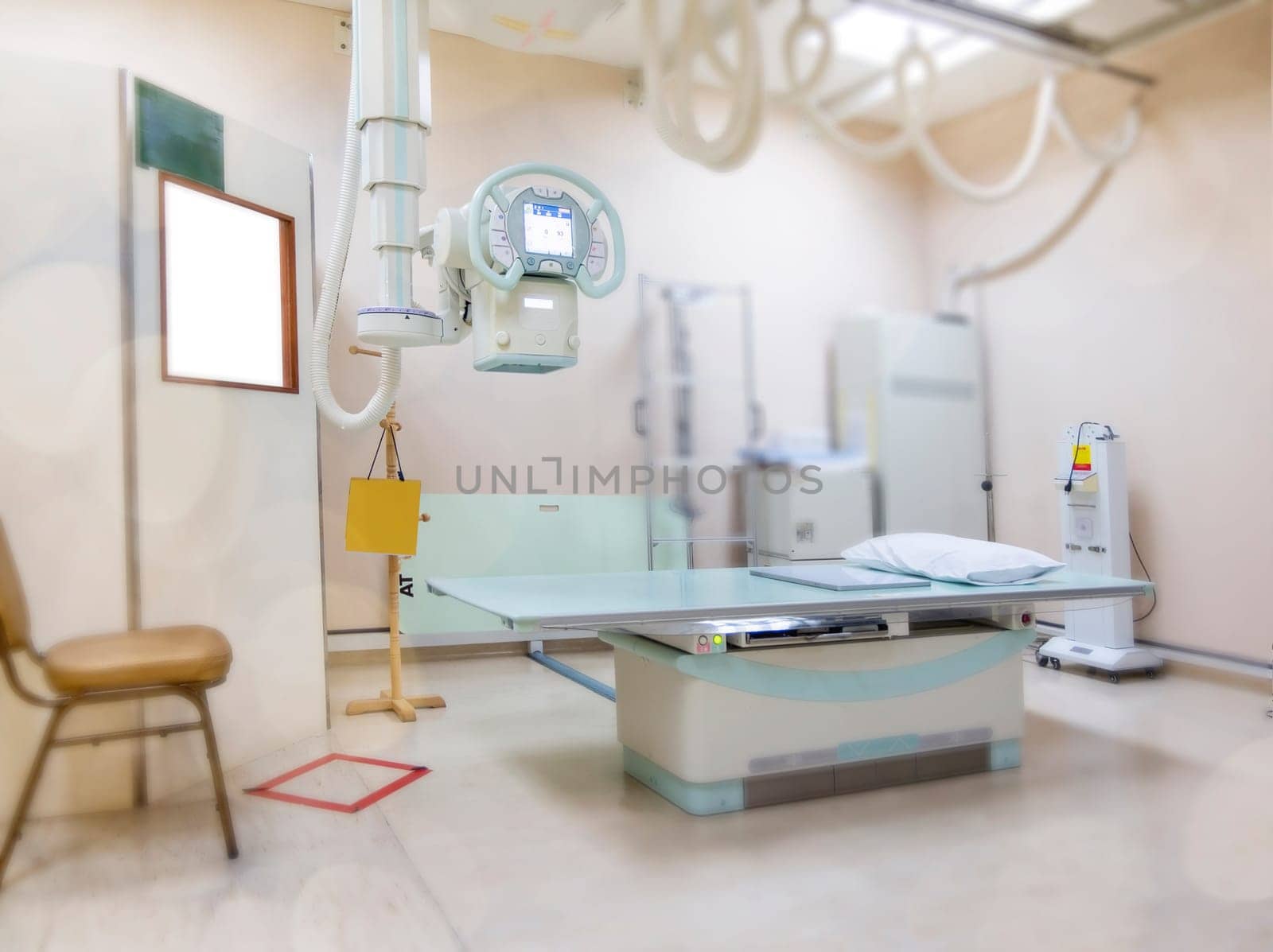 X-ray generator tube with monitor or X-ray general device with Bucky stand in radiology .modern medical equipment in the hospital. by samunella