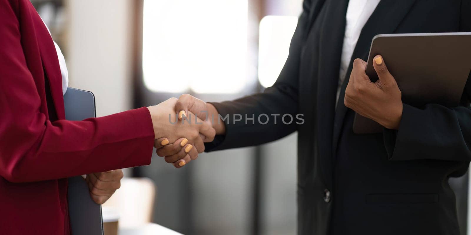 Business people shaking hands, finishing up meeting, business etiquette, congratulation, merger and acquisition concept.