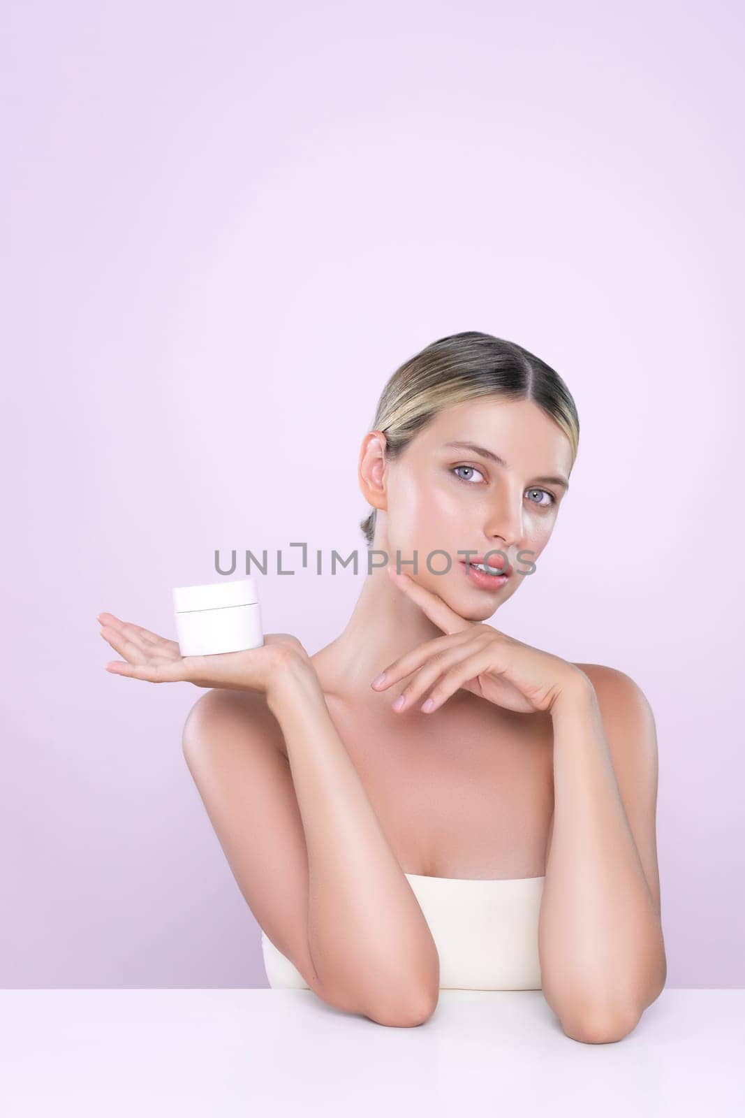 Alluring portrait of perfect skin woman holding mockup moisturizer jar. by biancoblue