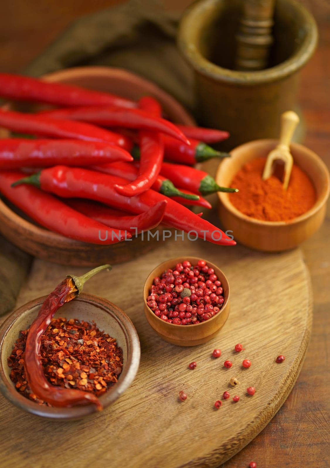 spicy food. Top view red dried crushed hot chili and raw chili in wooden bowl on rustic background, healthy spice by aprilphoto