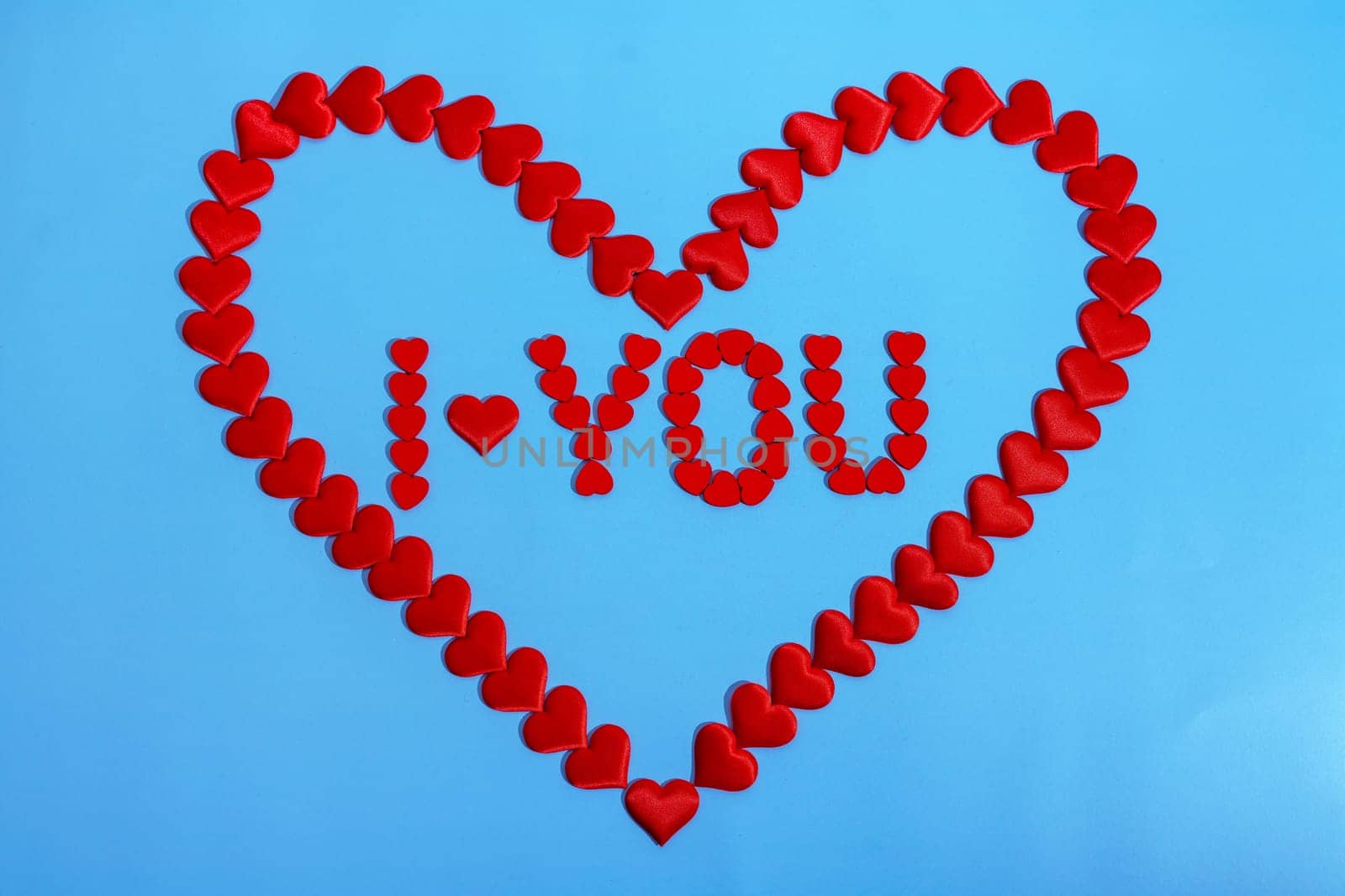 Heart love. Red heart shape from small hearts with the inscription I love you. Valentine's day lovers