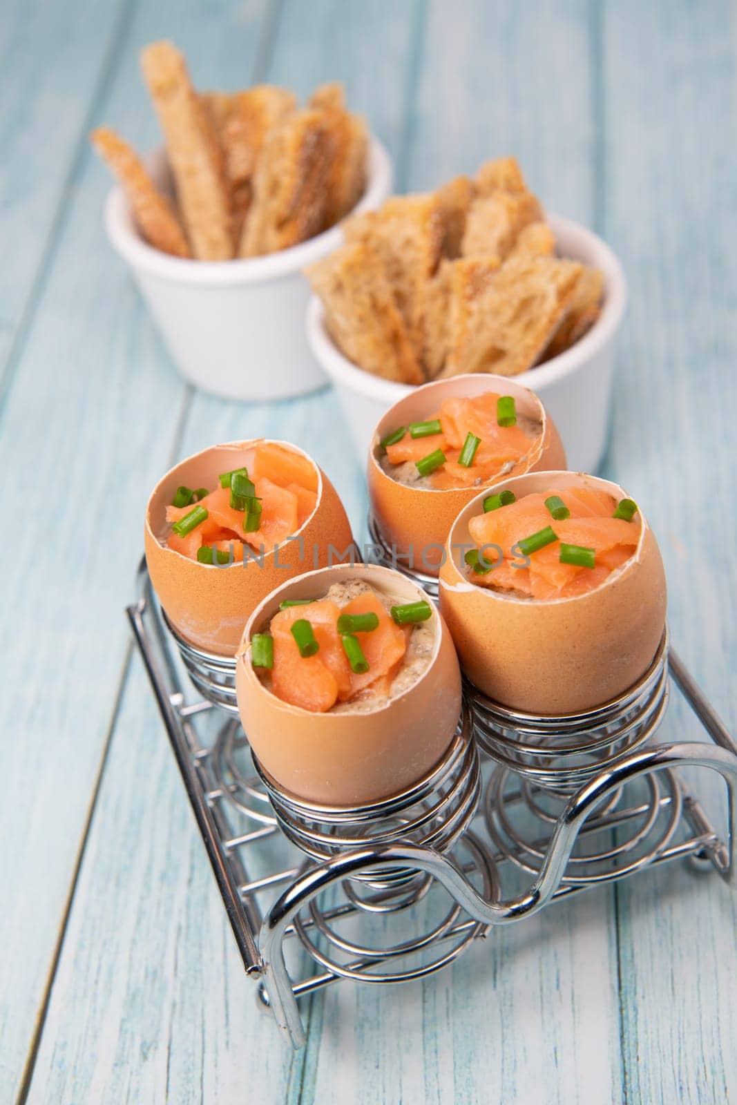 Recipe eggs casserole cooked in the shell with mushroom cream sauce and smoked salmon, High quality photo