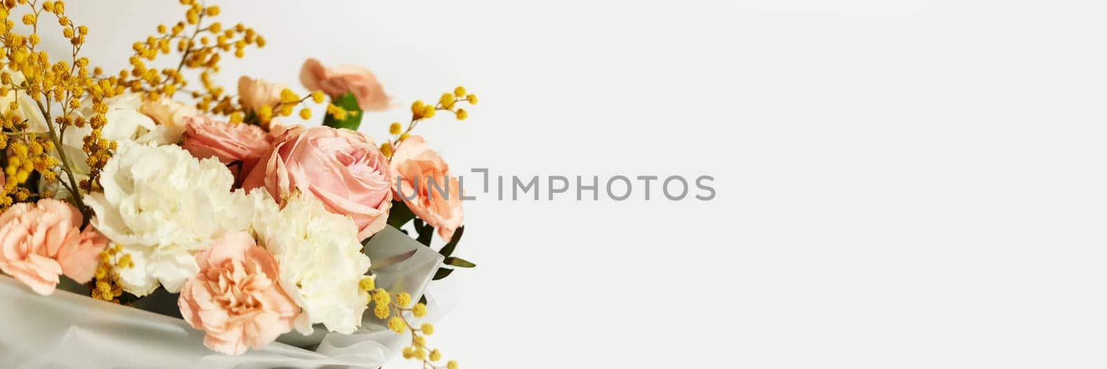 box with beautiful bouquet white and pink flowers on white background. Spring flowers. copy space