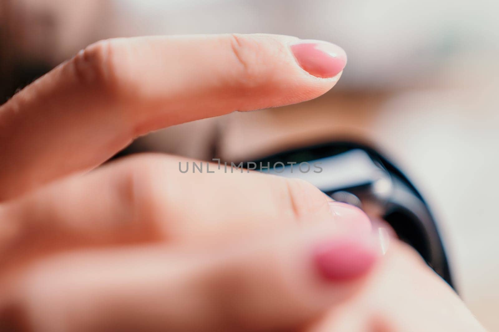Woman hand using smart watches mobile app with touch screen. New gadget to stay connected to internet. Stylish touchscreen wrist watches with navigation mobile application. Close up. Selective focus by panophotograph