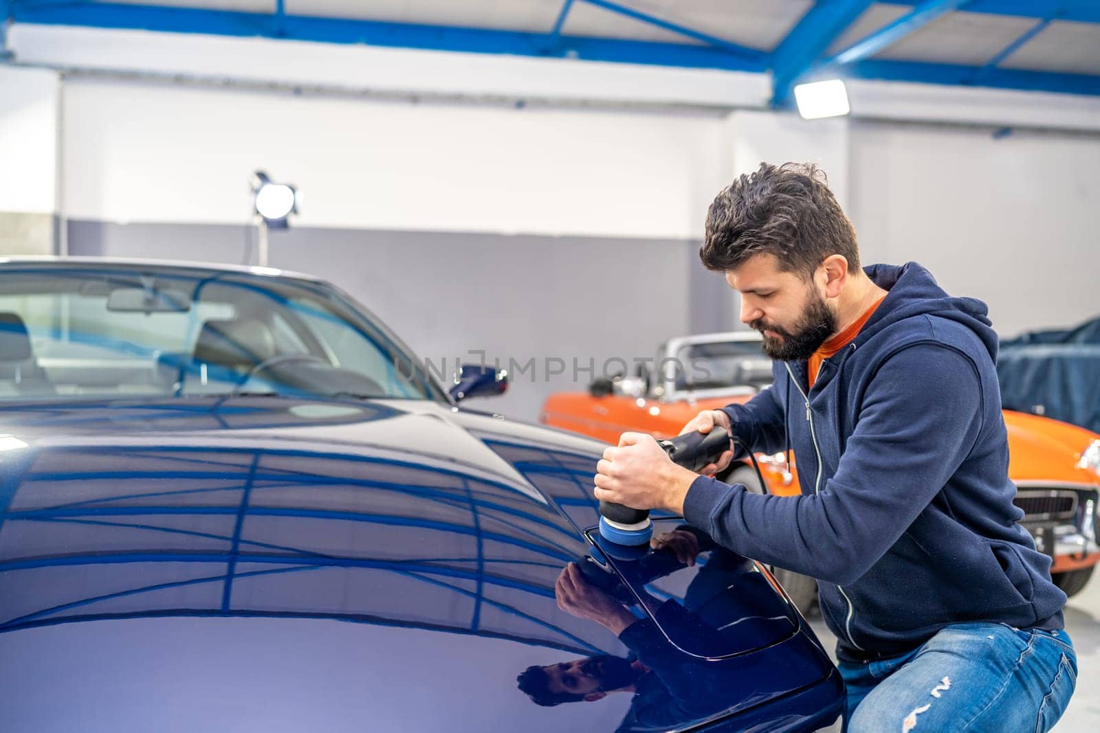 detailing of car body, polishing with using a mechanical sander, care about the car, automotive by Edophoto