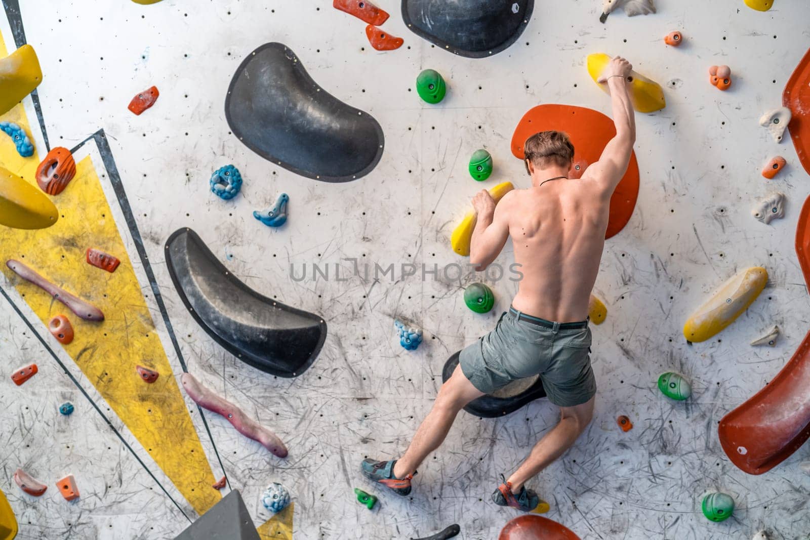 bouldering on an artificial climbing wall. High quality photo