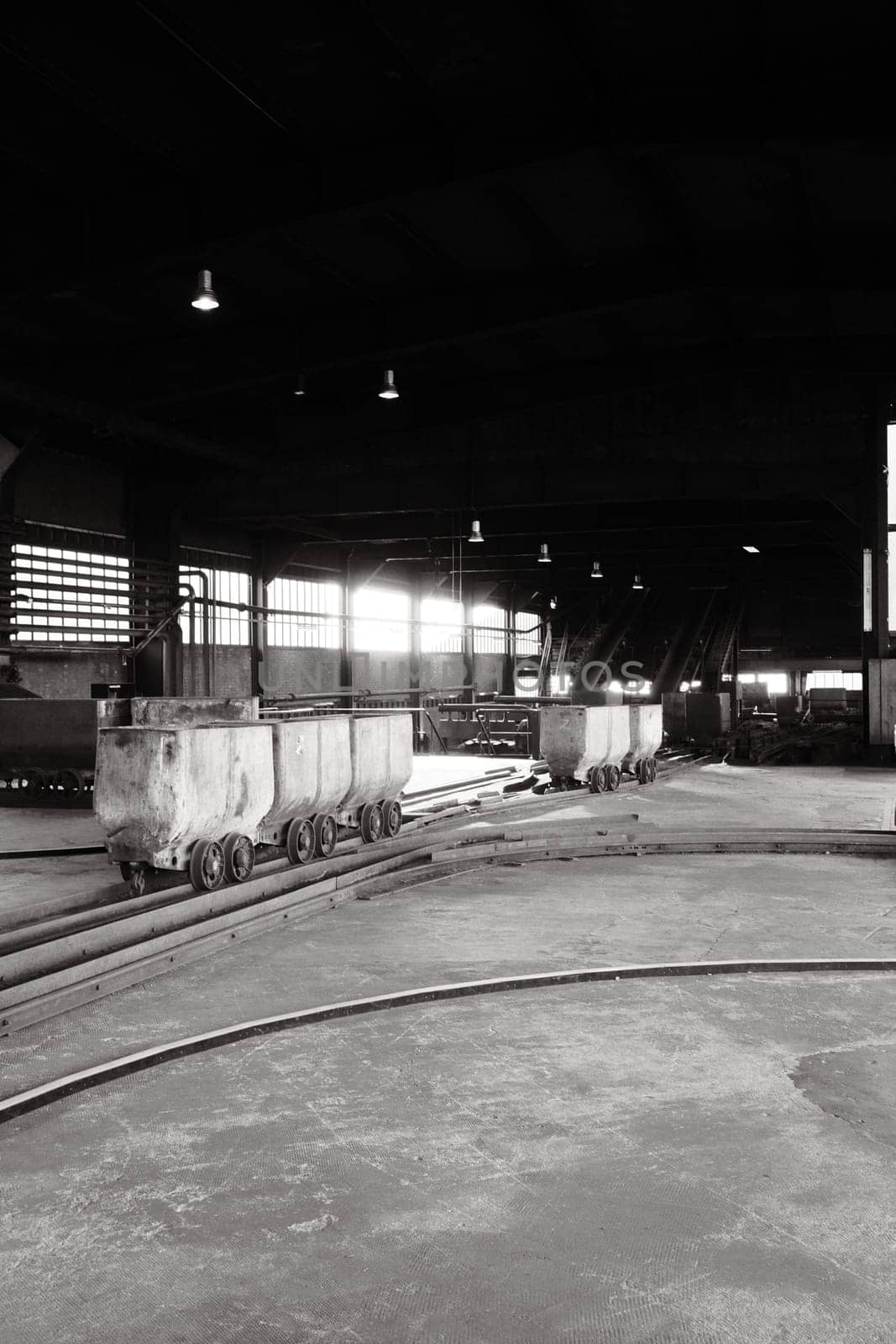 Coal lorries in a big hall in a mine in the Ruhr area, Germany