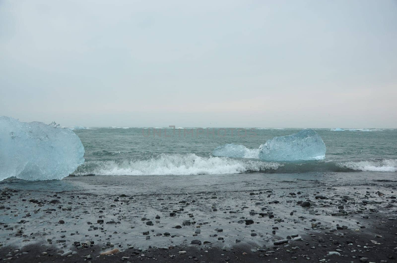 Black sand and crystal clear ice chunks at Diamond Beach in Fellsfjara, Jokulsarlon on Iceland