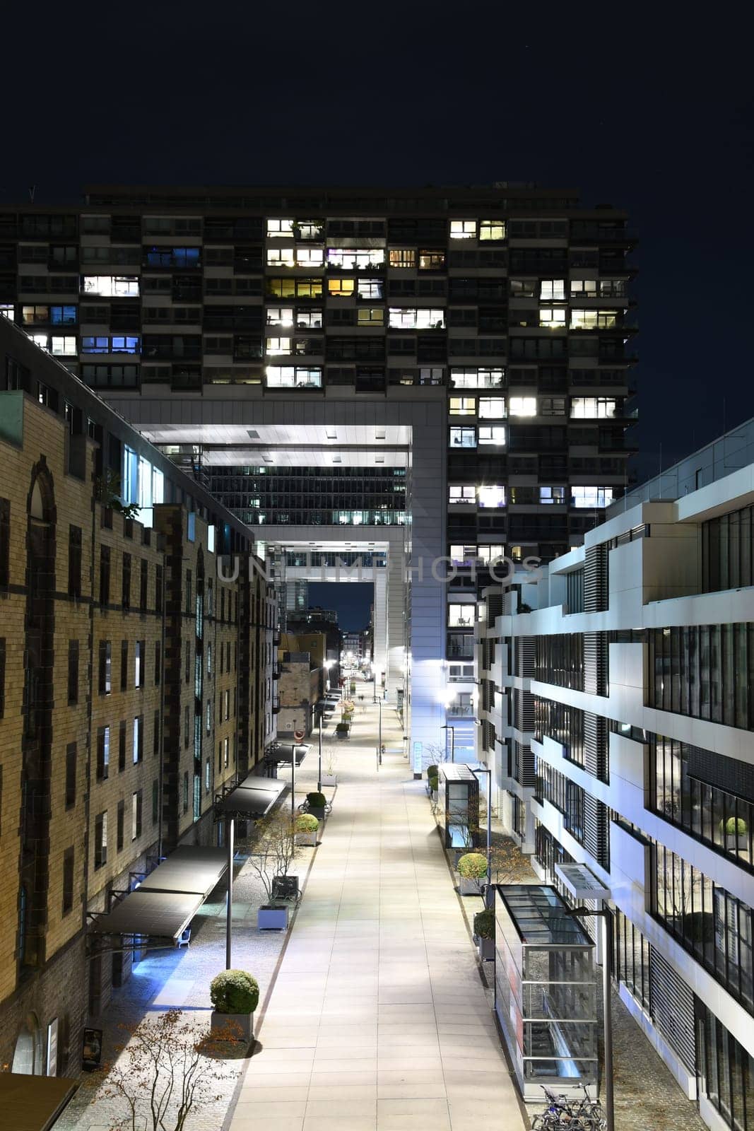 Zollhafen Street below and through the crane houses at night in Cologne, Germany