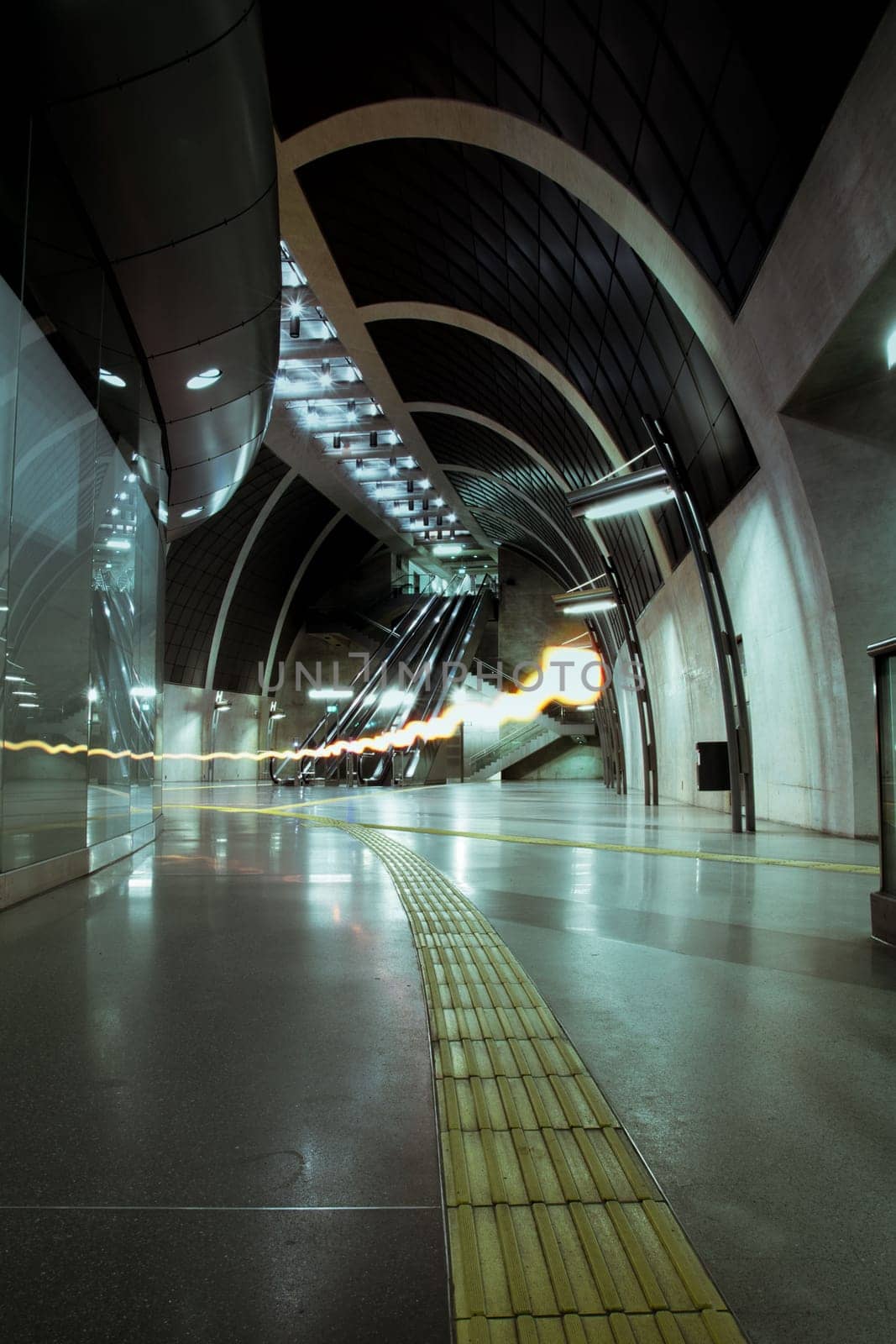 Vertical shot of a light resembling will-o'-the-wisp in a subway station in Cologne, Germany
