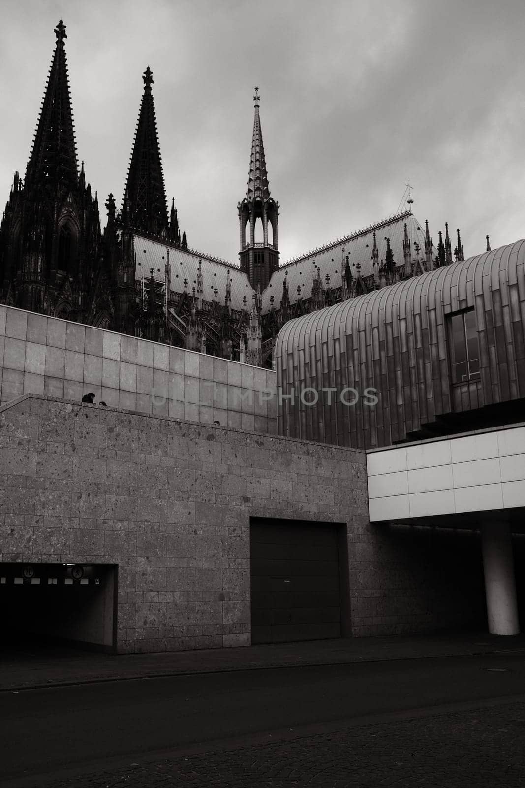 Cubist architecture of the Roman-Germanic Museum in front of Cologne Cathedral in Cologne, Germany