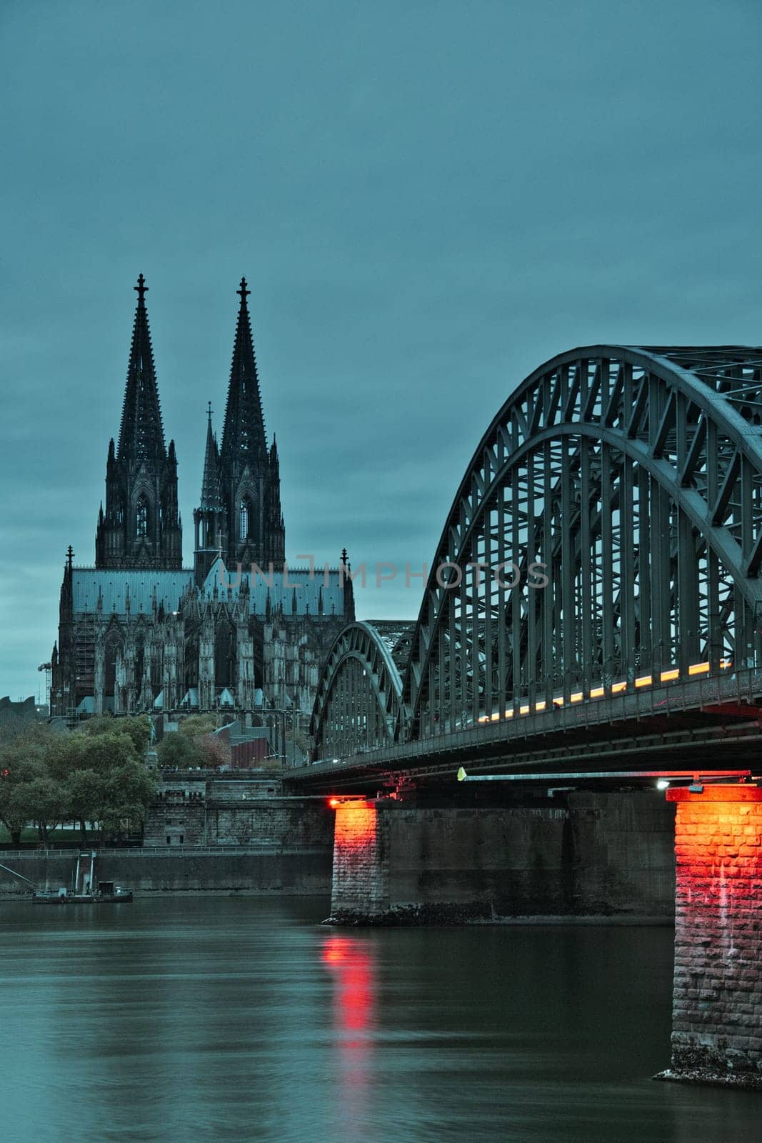 Cologne Cathedral and the Hohenzollern Bridge at dusk