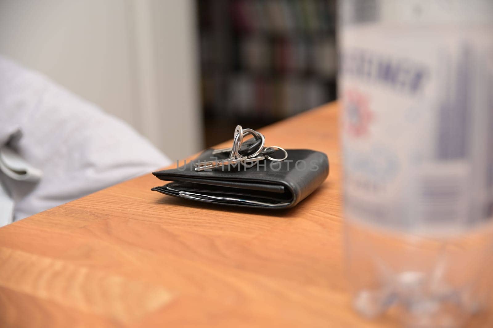 Bunch of keys on a black leather wallet
