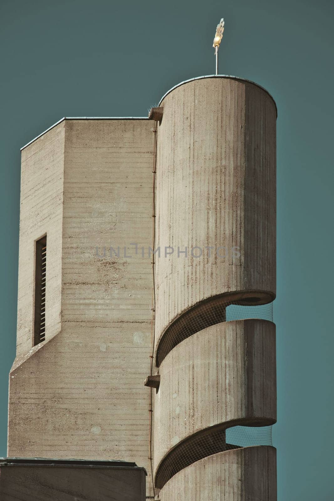 Vertical shot of a church tower with a spiral staircase