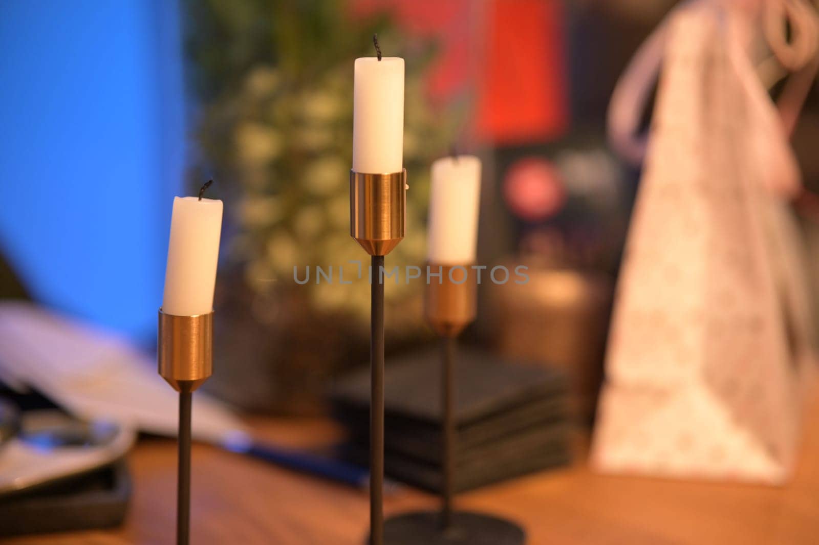 Three burnt out white candles