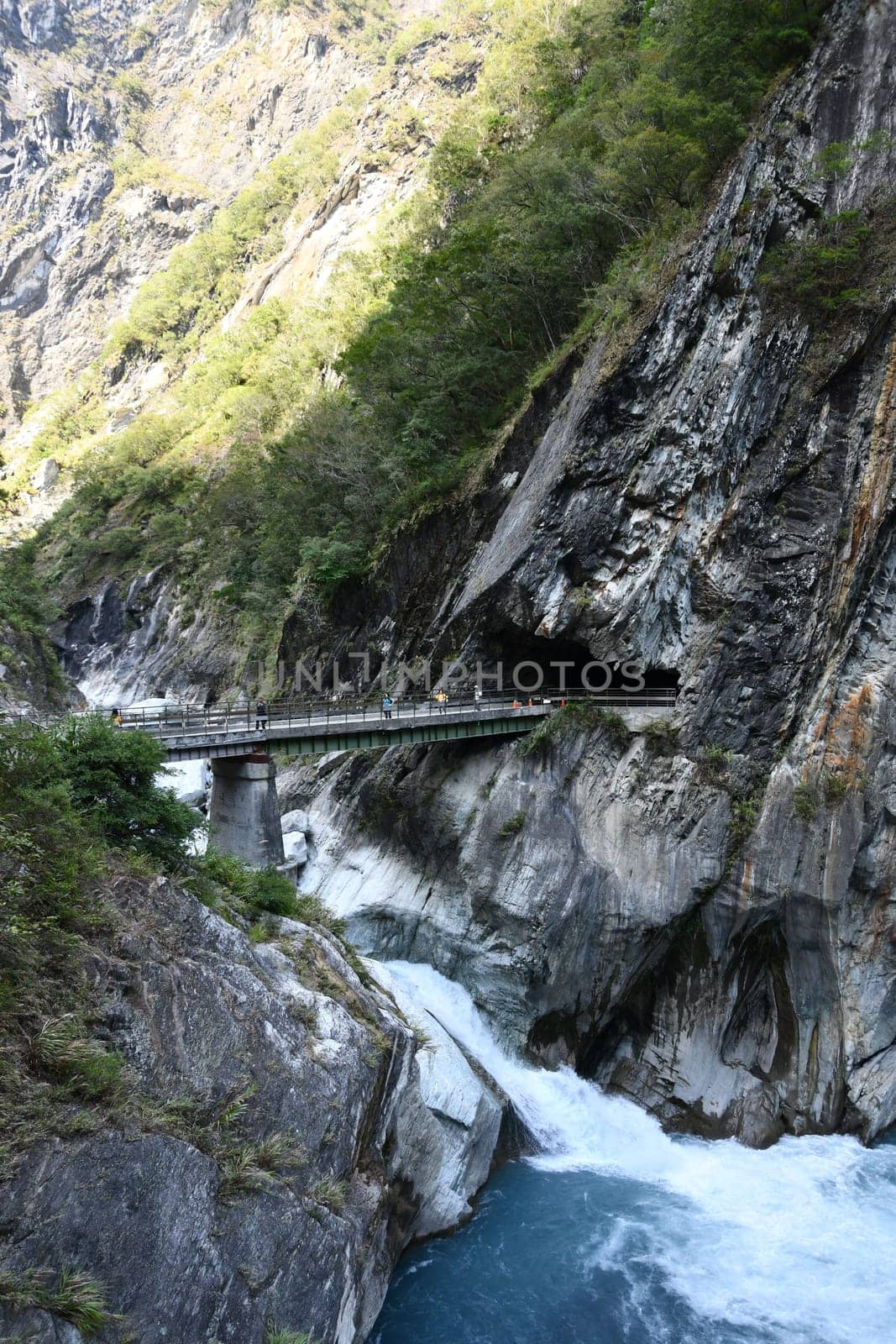 Vertical shot of the Ice blue river and the bridge over it in Tianxiang, Hualien, Taiwan