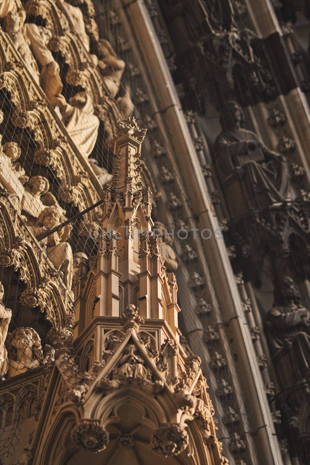 Vertical shot of the facade of the Cologne Cathedral with decoration and ornaments, Cologne, Germany
