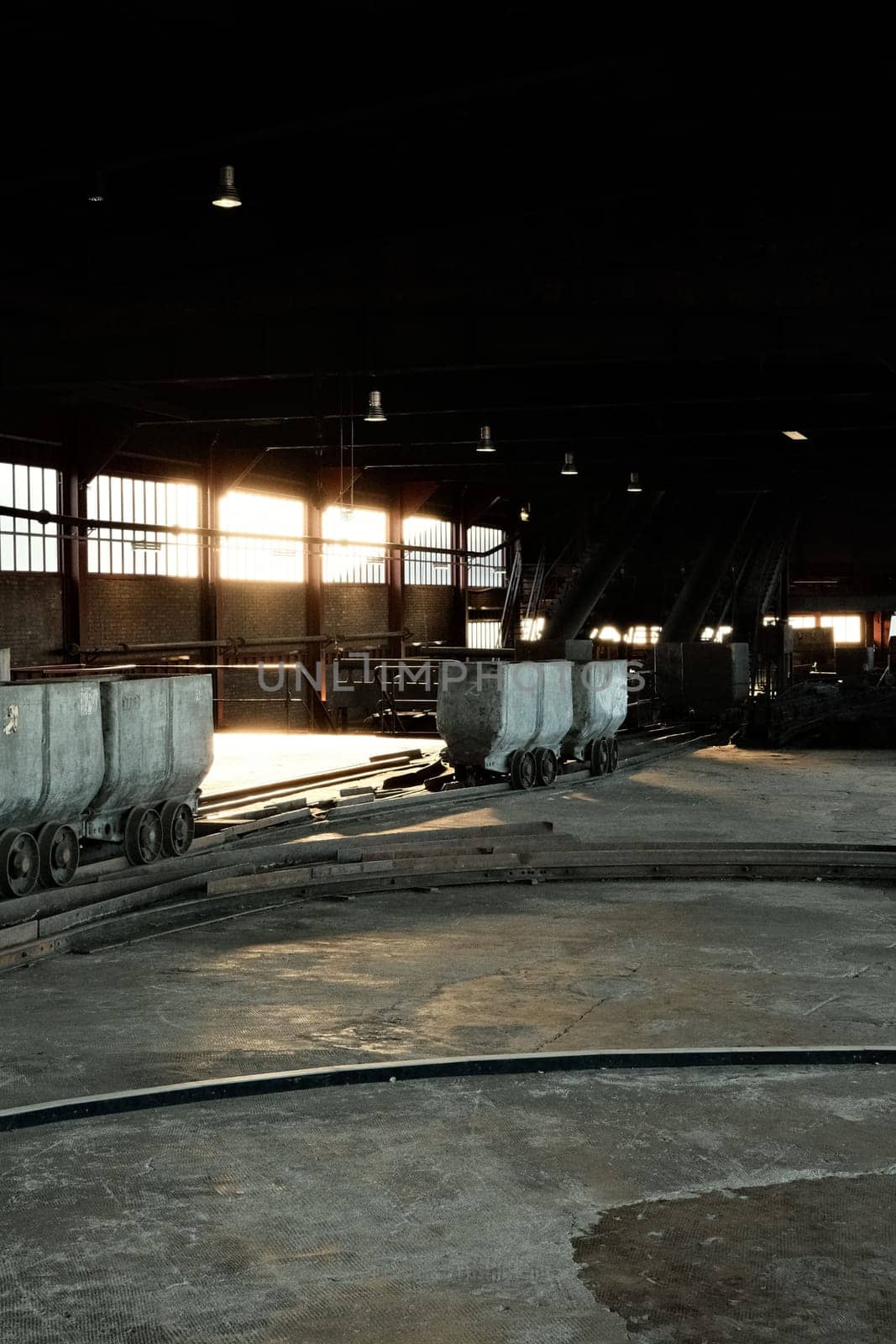 Coal lorries in a big hall in a mine in the Ruhr area, Germany