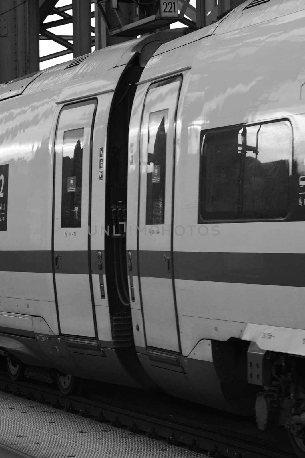 Grayscale closeup of the wagon and the door of a German express train in Cologne, Germany
