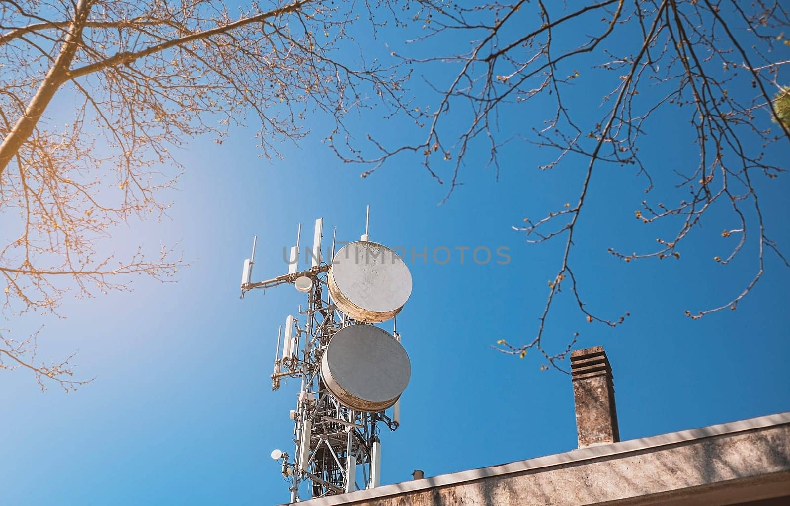 Telecommunication towers with wireless antennas against the sky. TV tower or radio tower.