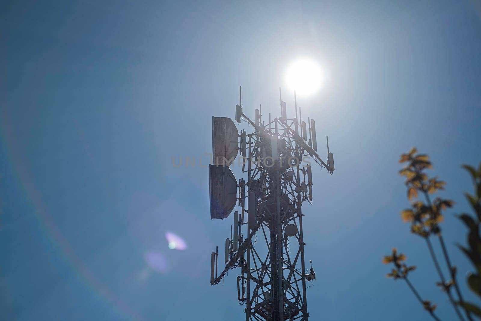 Telecommunication towers with wireless antennas against the sky. TV tower or radio tower.