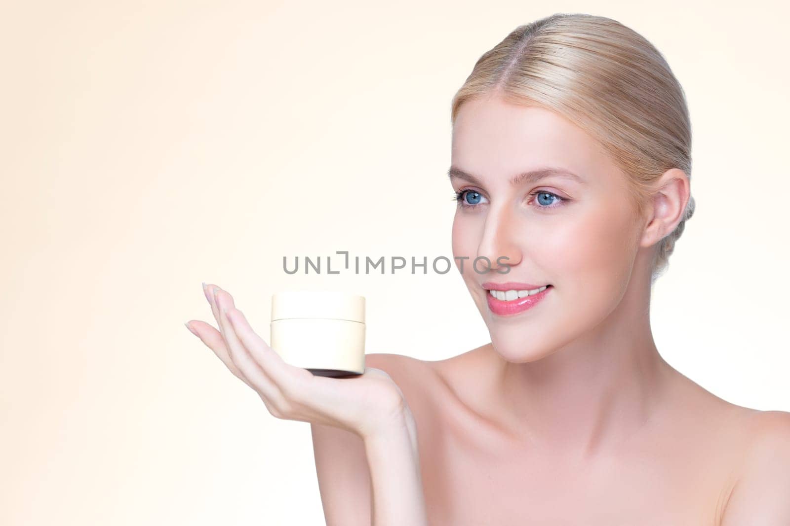 Personable beautiful perfect natural skin woman hold mockup tube moisturizer cream for skincare treatment product advertisement in isolated background with expressive facial and gesture expression.
