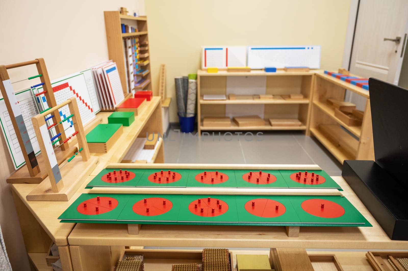 Classroom of Montessori kindergarten. The colorful Montessori material. Concept of children learning toy